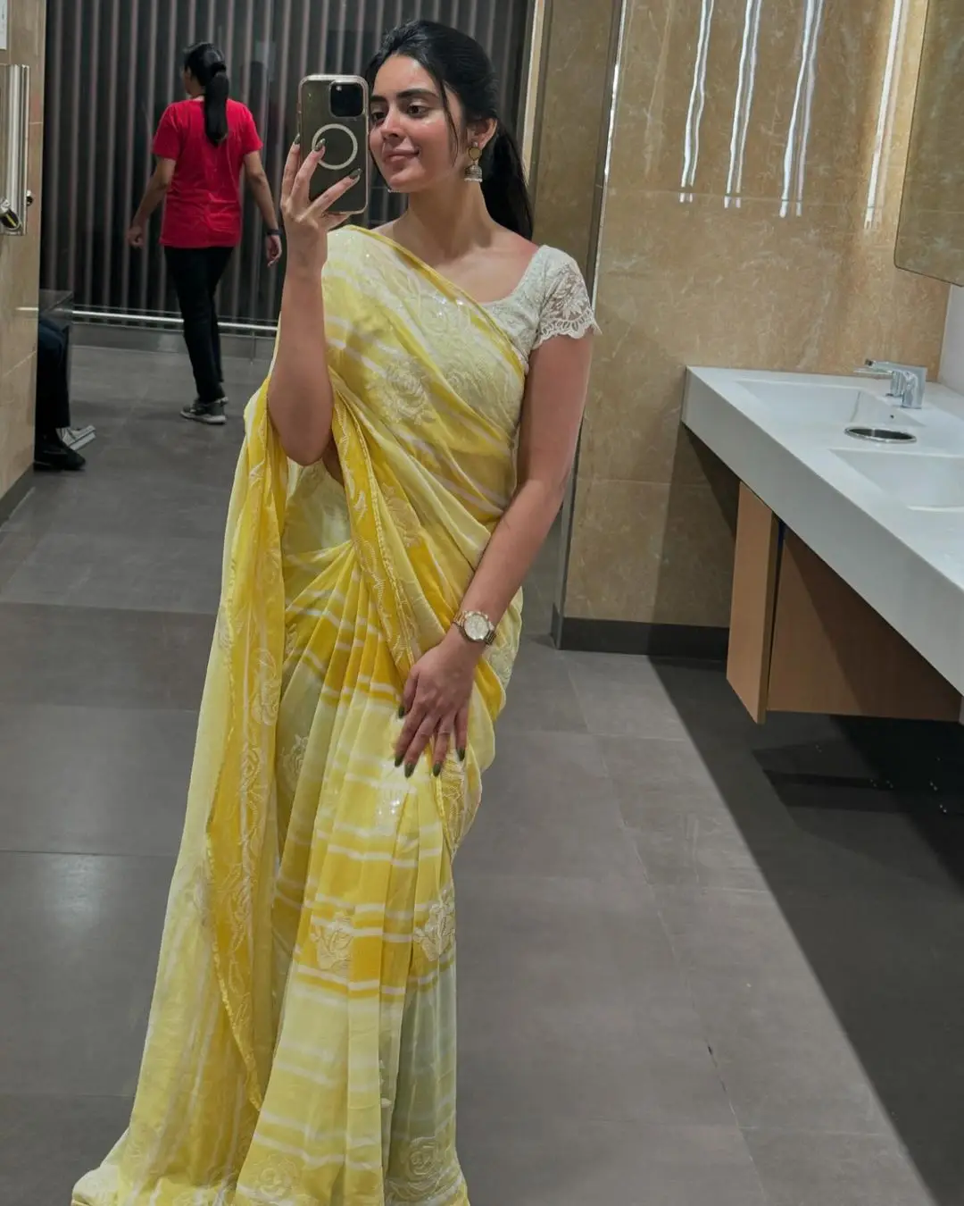 Kushita Kallapu In Traditional Yellow Saree White Blouse